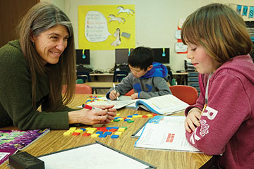 Elizabeth Julian, Head Teacher at Boulder Elementary School, and her students. Photo from www.insiderutah.com
