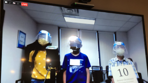 Winners of the 2021 SEDC Regional Spelling Bee, shown on the video conference call with their full protective gear on!