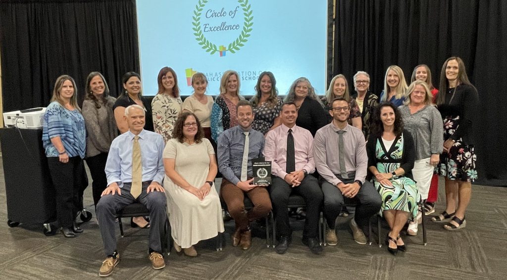 photo of teachers and adminstrators from George Washington Academy accepting the 2021 Charter School of the Year award at the Utah Charter Schools Conference