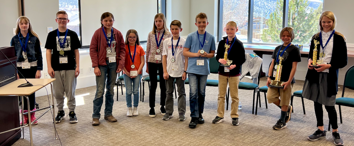 Spellers from across the SEDC Region, including students from Millard, Beaver, Iron and Washington counties, show their rewards and trophies after the 5th Annual SEDC Regional Spelling Bee for 2023.