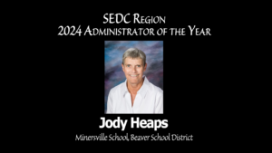 Video Thumbnail for Jody Heaps, SEDC's 2024 Administrator of the Year. She is from Minersville School in Beaver. Includes a photo of Jody on a black background with white text.
